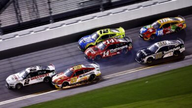 DAYTONA BEACH, FLORIDA - FEBRUARY 20: Austin Cindric, driver of the #2 Discount Tire Ford, and Bubba Wallace, driver of the #23 McDonald's Toyota, race to the finish of the NASCAR Cup Series 64th Annual Daytona 500 at Daytona International Speedway on February 20, 2022 in Daytona Beach, Florida