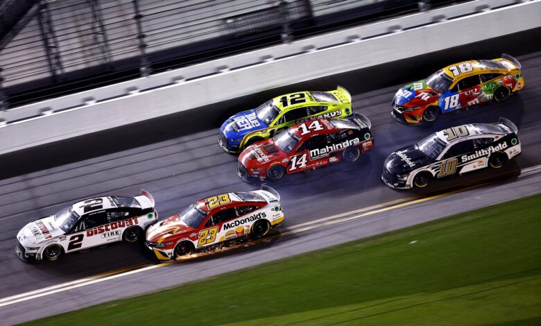 DAYTONA BEACH, FLORIDA - FEBRUARY 20: Austin Cindric, driver of the #2 Discount Tire Ford, and Bubba Wallace, driver of the #23 McDonald's Toyota, race to the finish of the NASCAR Cup Series 64th Annual Daytona 500 at Daytona International Speedway on February 20, 2022 in Daytona Beach, Florida