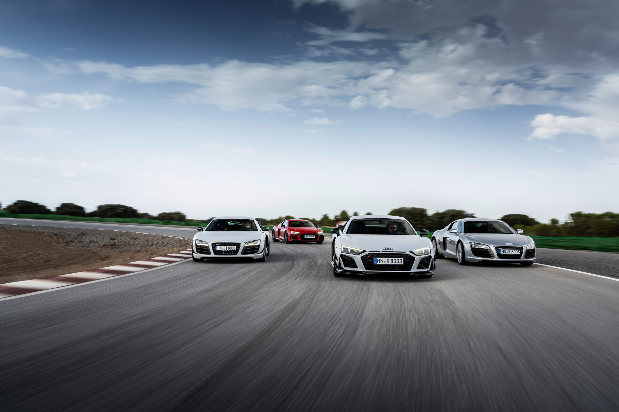 Static photo: Audi R8 Coupé V10 GT RWD, Colour: Suzuka Grey, Audi R8 Coupé V10 performance RWD, Colour: Tango red, Audi R8 GT Coupé (1st Generation), Colour: Suzuka Grey, Audi R8 5.2 FSI quattro (1st Generation), Colour: Silver metallic.