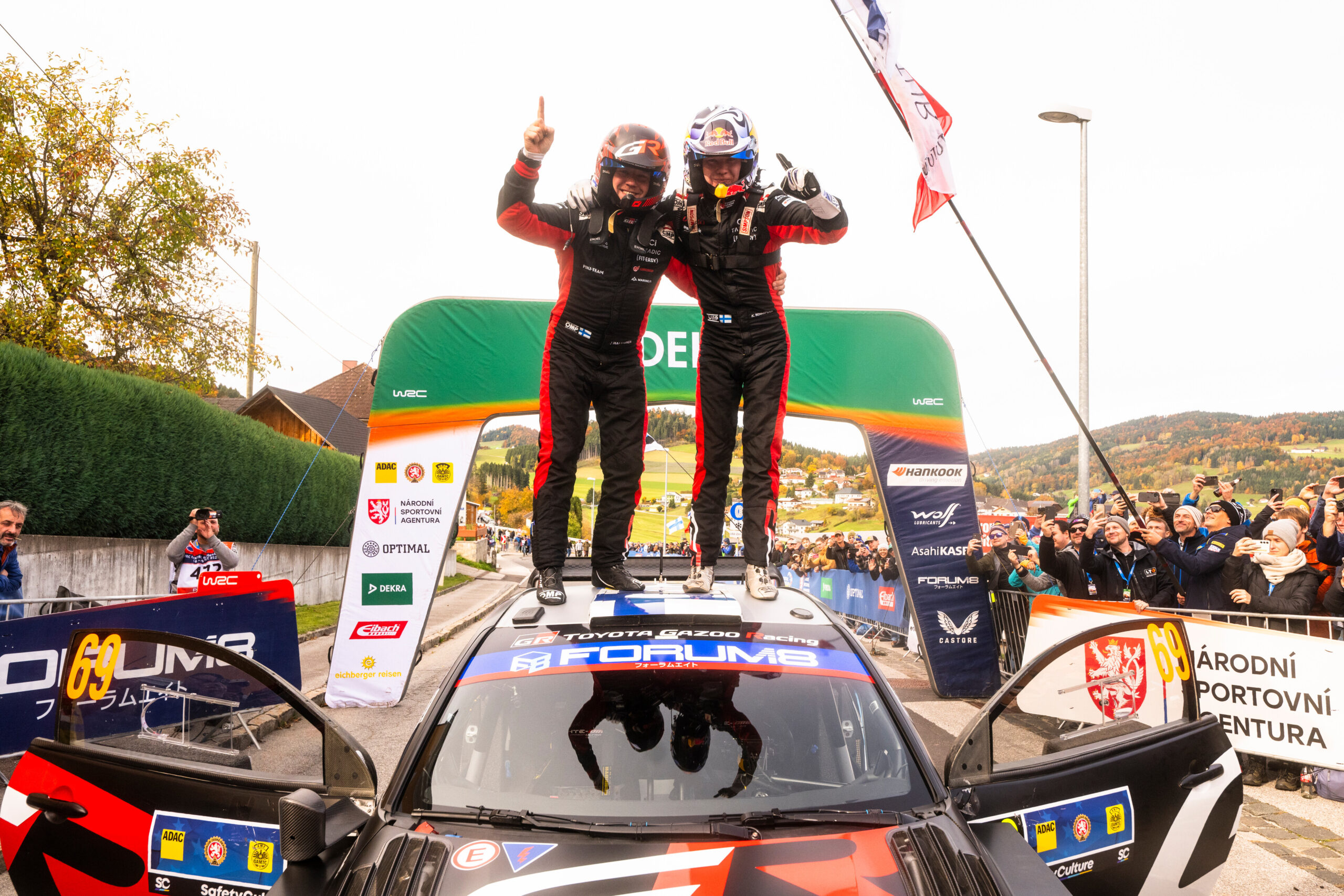 Kalle Rovanperä (FIN) Jonne Halttunen (FIN) Of Toyota Gazoo Racing Wrt celebrate on the podium in first place after winning the World Rally Championship in Passau, Germany on 19.10.2025 //
