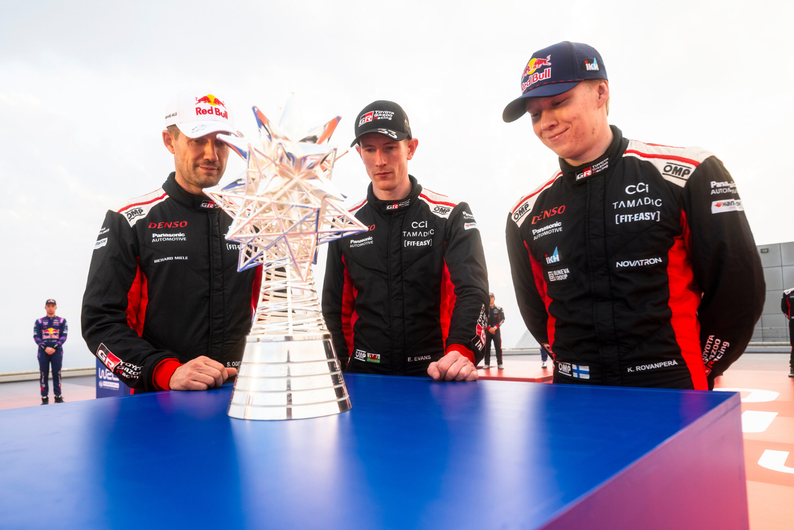 Kalle Rovanperä (FIN), Sebastien Ogier (FRA) and Elfyn Evans (GB) of team TOYOTA GAZOO RACING WRT seen during stop 14 of the FIA World Rally Championship in Jeddah, Saudi Arabia on November 25, 2025. //