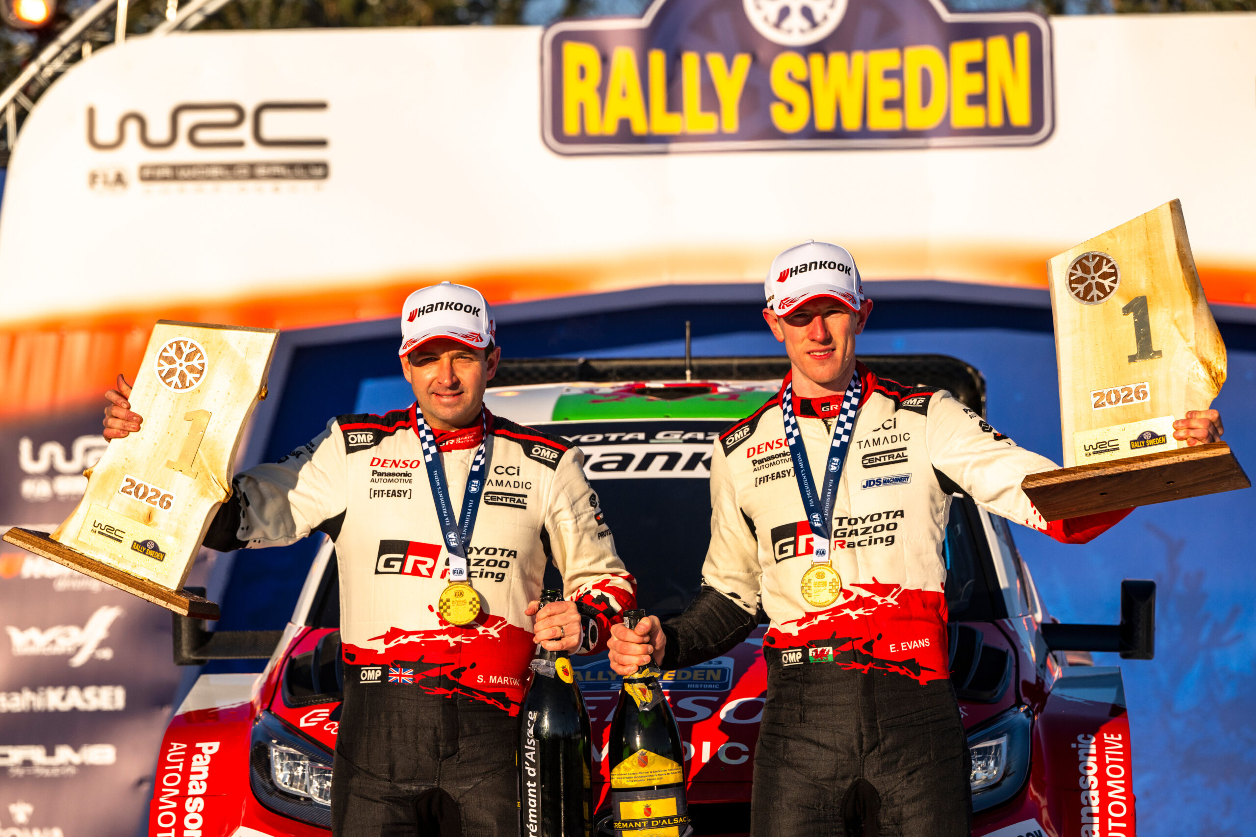 Elfyn Evans (GBR) Scott Martin (GBR) Of team TOYOTA GAZOO RACING WRT celebrate on the podium in first place after winning the World Rally Championship in Umea, Sweden on 15.02.2026 //