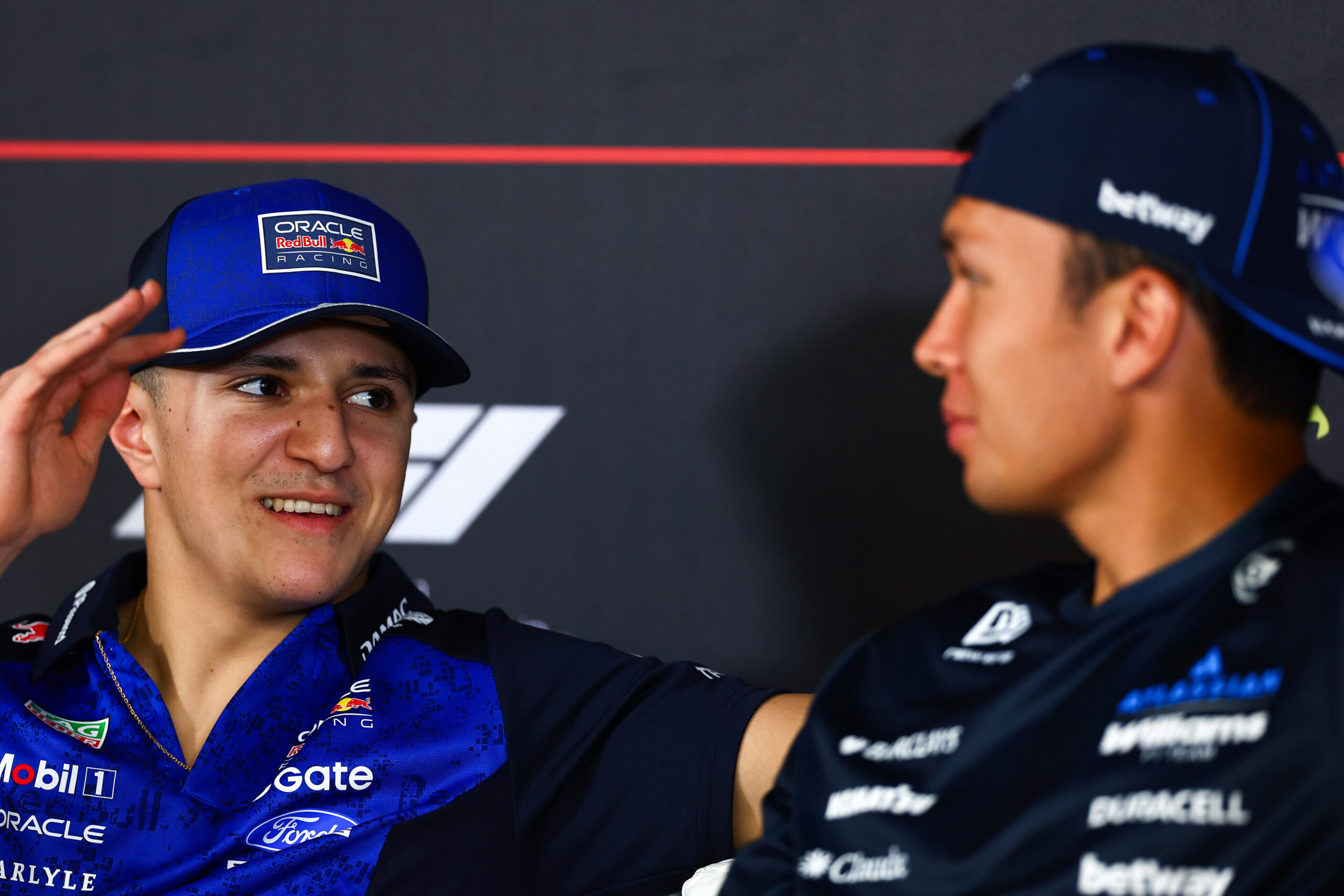 BAHRAIN, BAHRAIN - FEBRUARY 20: Isack Hadjar of France and Oracle Red Bull Racing and Alexander Albon of Thailand and Williams talk in the Drivers Press Conference during day three of F1 Testing at Bahrain International Circuit on February 20, 2026 in Bahrain, Bahrain. (Photo by
