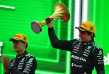 SHANGHAI, CHINA - MARCH 15: Race winner Andrea Kimi Antonelli of Italy and Mercedes AMG Petronas F1 Team lifts his trophy on the podium during the F1 Grand Prix of China at Shanghai International Circuit on March 15, 2026 in Shanghai, China. (Photo by