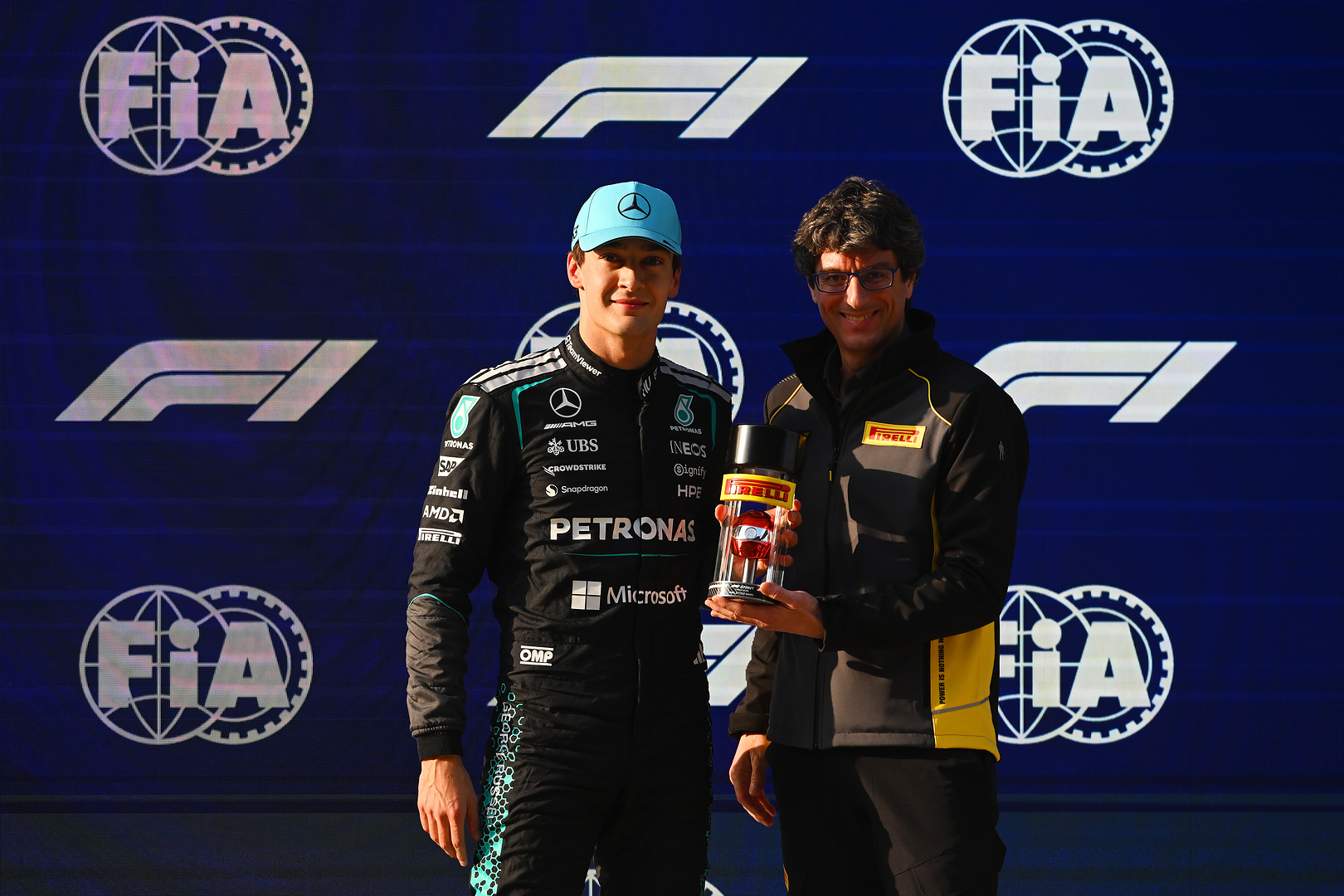 Chinese Grand Prix, Friday, Getty Images SHANGHAI, CHINA - MARCH 13: Pole position qualifier George Russell of Great Britain and Mercedes AMG Petronas F1 Team receives his Pirelli Sprint Pole award from Dario Marrafuschi, Head of Motorsport of Pirelli during Sprint qualifying ahead of the F1 Grand Prix of China at Shanghai International Circuit on March 13, 2026 in Shanghai, China. (Photo by