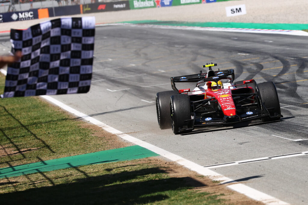 BARCELONA, SPAIN - JUNE 14: Race winner Lewis Hamilton of Great Britain driving the (44) Scuderia Ferrari SF-26 takes the chequered flag during the F1 Grand Prix of Barcelona-Catalunya at Circuit de Barcelona-Catalunya on June 14, 2026 in Barcelona, Spain. (Photo by