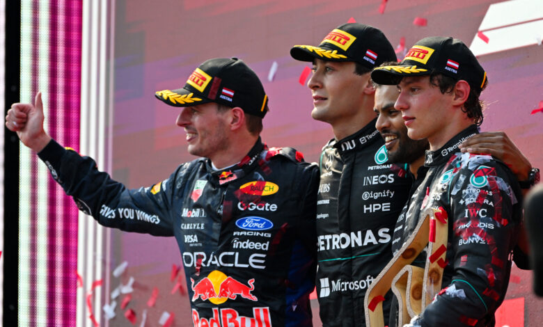 SPIELBERG, AUSTRIA - JUNE 28: Race winner George Russell of Great Britain and Mercedes AMG Petronas F1 Team, Second placed Max Verstappen of the Netherlands and Oracle Red Bull Racing, Third placed Andrea Kimi Antonelli of Italy and Mercedes AMG Petronas F1 Team and Arun Rajkumar, Trackside Powerunit Engineer of Mercedes AMG Petronas F1 Team celebrate on the podium during the F1 Grand Prix of Austria at Red Bull Ring on June 28, 2026 in Spielberg, Austria. (Photo by