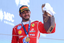 BARCELONA, SPAIN - JUNE 14: Race winner Lewis Hamilton of Great Britain and Scuderia Ferrari celebrates with his trophy on the podium during the F1 Grand Prix of Barcelona-Catalunya at Circuit de Barcelona-Catalunya on June 14, 2026 in Barcelona, Spain. (Photo by