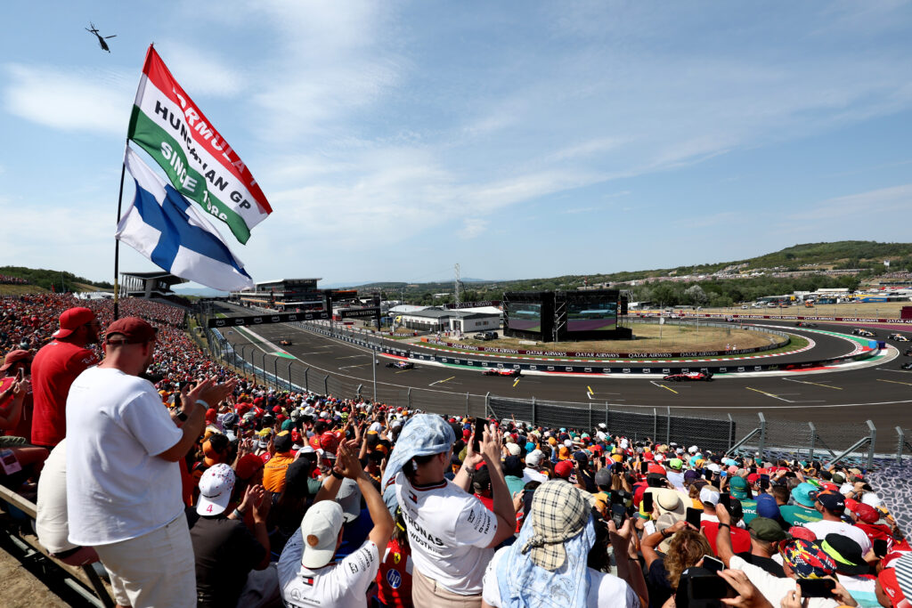 BUDAPEST, HUNGARY - JULY 26: Lando Norris of Great Britain driving the (1) McLaren MCL40 Mercedes leads Max Verstappen of the Netherlands driving the (3) Oracle Red Bull Racing RB22 Red Bull Ford Powertrains and Lewis Hamilton of Great Britain driving the (44) Scuderia Ferrari SF-26 on track during the F1 Grand Prix of Hungary at Hungaroring on July 26, 2026 in Budapest, Hungary. (Photo by