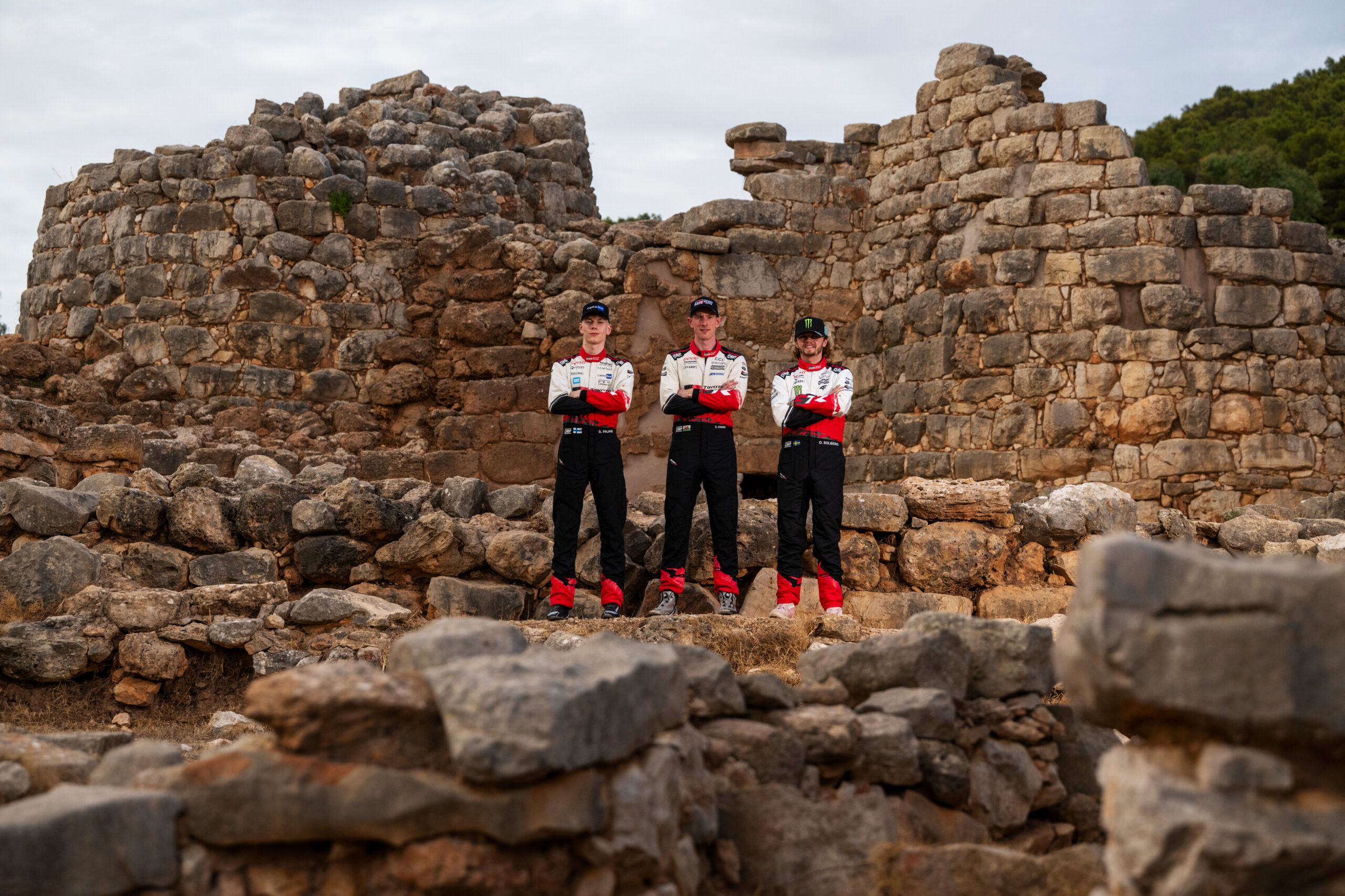 Elfyn Evans (GBR) of team TOYOTA GAZOO RACING WRT , Sami Pajari (FIN) of team TOYOTA GAZOO RACING WRT2 and Oliver Solberg (SWE) of team TOYOTA GAZOO RACING WRT pose for a photo during Stop 13 of the FIA World Rally Championship in Alghero, Italy on October 1, 2026. //
